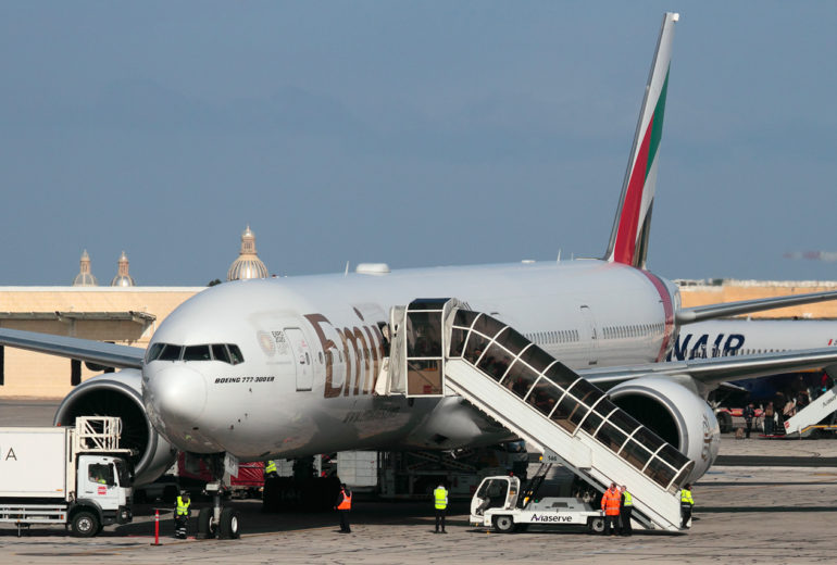 Passengers disembarking from a flight from Dubai to Malta in December 2019.